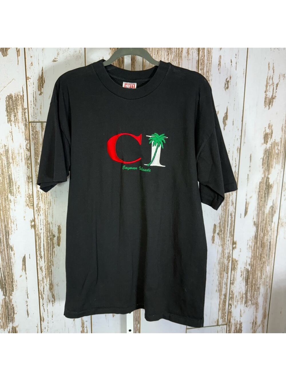 Hefty, Cayman Islands Embroidered Black Graphic Tee with Palm Design. Size XL.